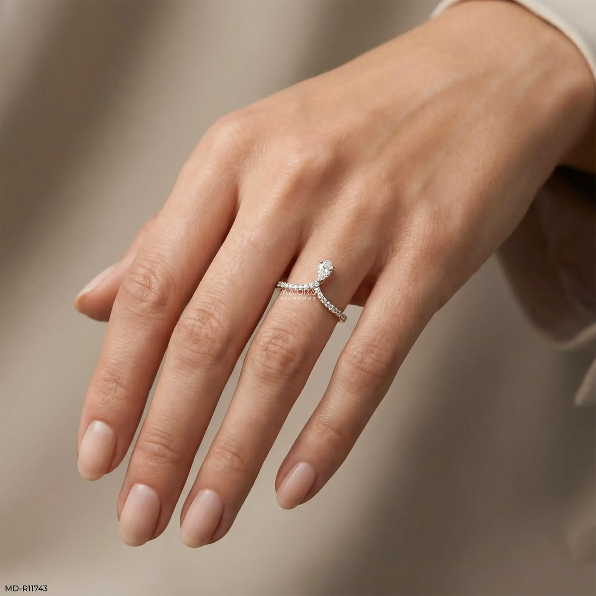 Sleek Curve Pear Vanki Diamond Ring